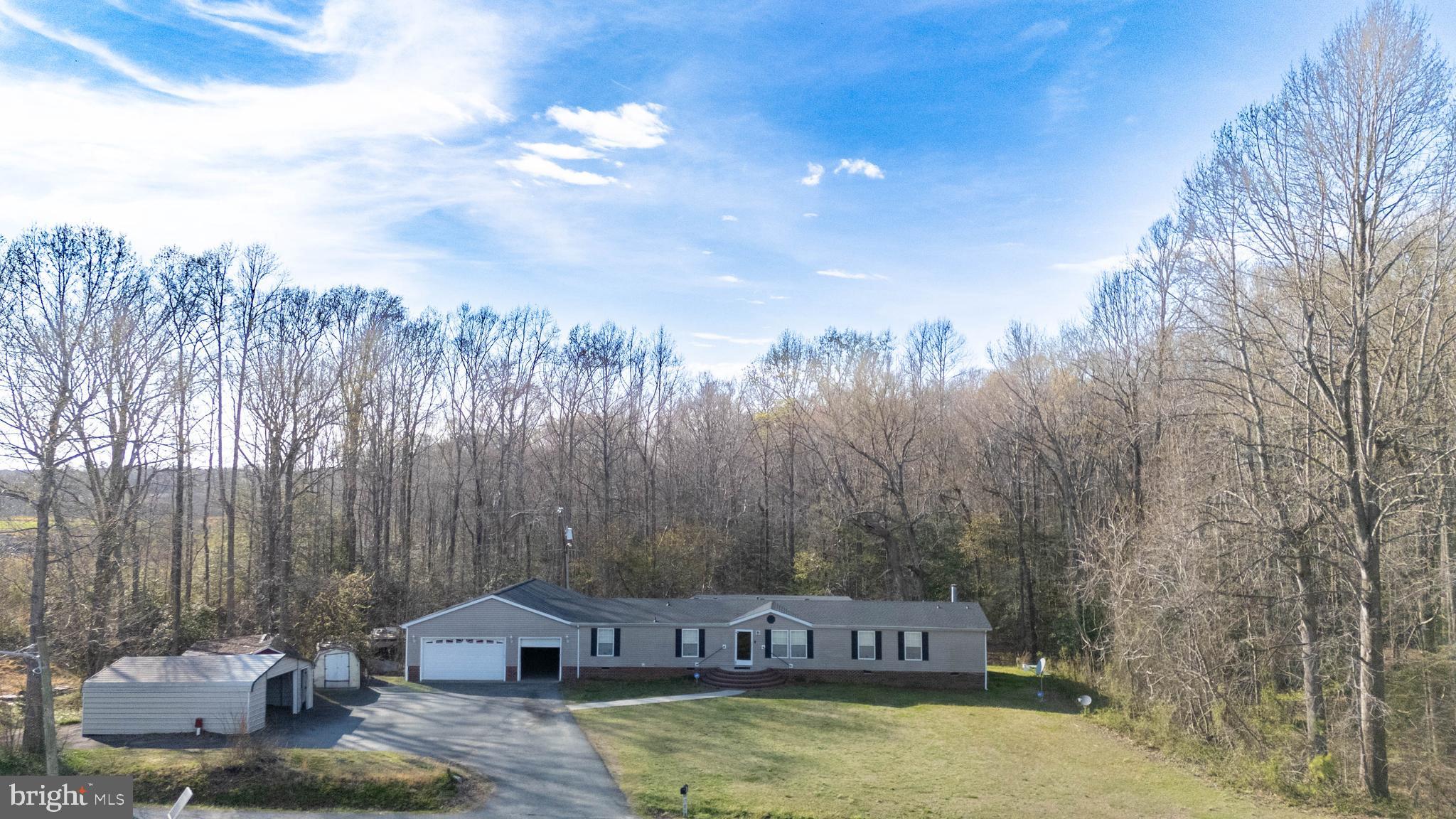 8791 Menokin Road Montross, VA 22520 - Photo 5 of 37 a view of a house with a yard and sitting area