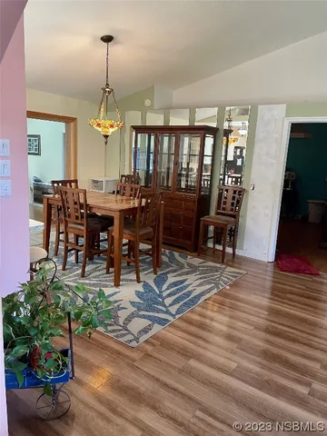 a living room with furniture a rug and a chandelier