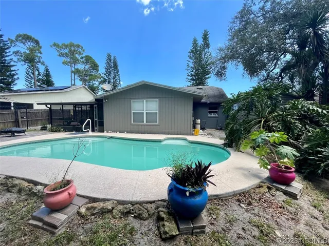 a house view with a seating space and garden
