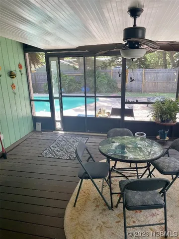 a bedroom with a bed and a flat tv screen on dresser