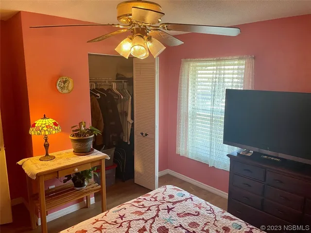 a view of a dining room with a table and chairs