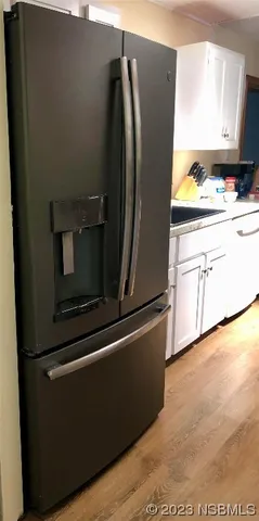 a kitchen with appliances and cabinets