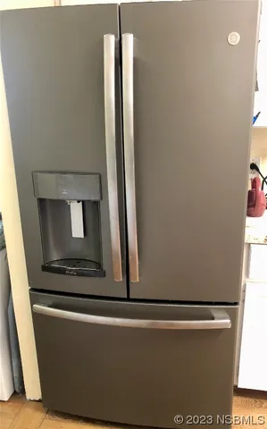 a kitchen with a sink a stove and cabinets