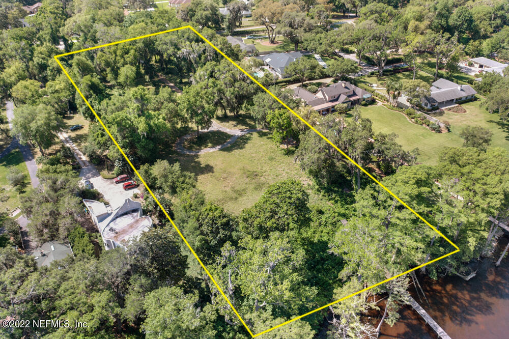12274 Mandarin Road Jacksonville, FL 32223 - Photo 7 of 12 an aerial view of residential houses with outdoor space