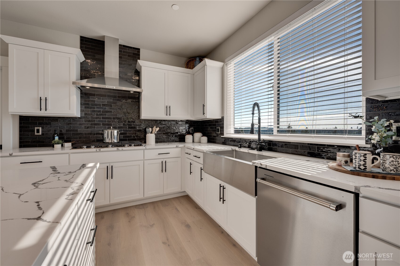 20411 125th Avenue Northeast, Unit SM 20 Bothell, WA 98011 - Photo 15 of 34 a kitchen with stainless steel appliances granite countertop a sink a stove and cabinets