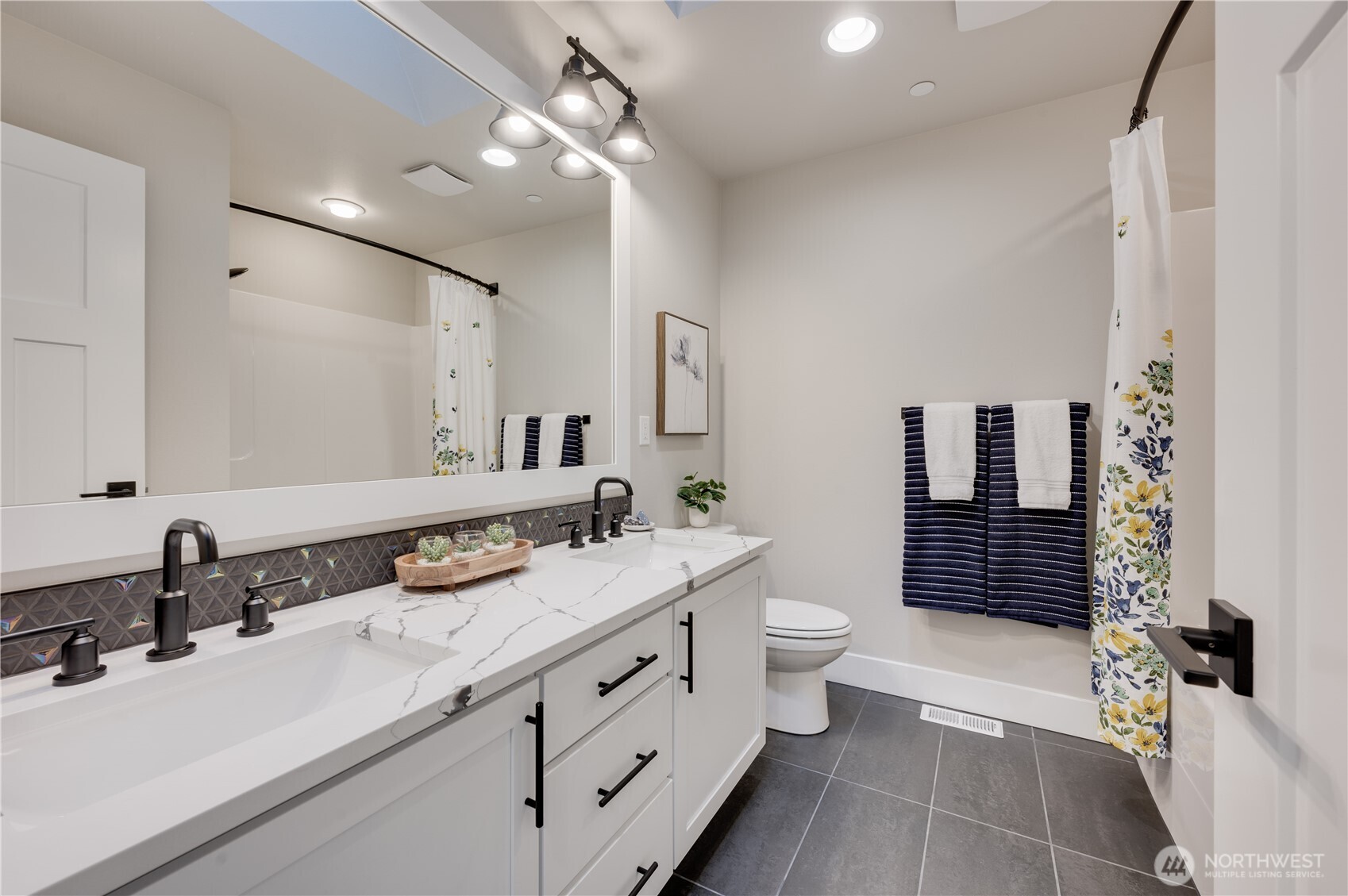 20411 125th Avenue Northeast, Unit SM 20 Bothell, WA 98011 - Photo 27 of 34 a bathroom with a double vanity sink toilet and shower