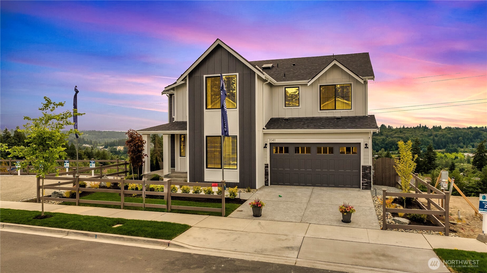 20411 125th Avenue Northeast, Unit SM 20 Bothell, WA 98011 - Photo 3 of 34 a front view of a house with a yard