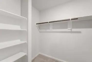 a view of an empty walk in closet