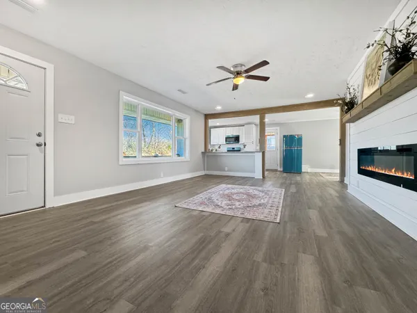 a view of livingroom with hardwood floor and a ceiling fan