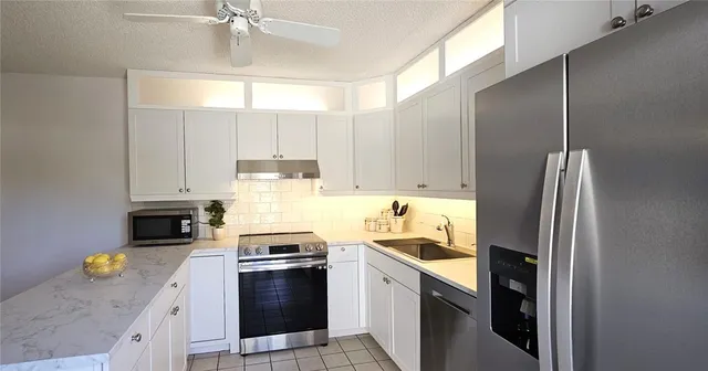 a bathroom with a sink a toilet and vanity