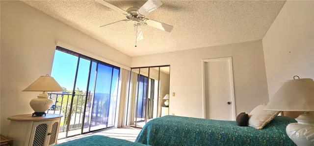 a bedroom with a bed and a lamp on table