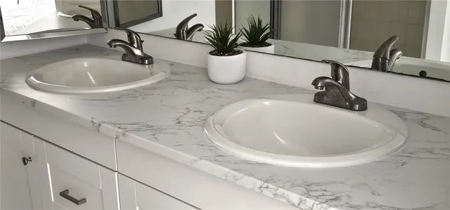 a view of table and chairs in a garden