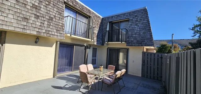 a patio with table and chairs