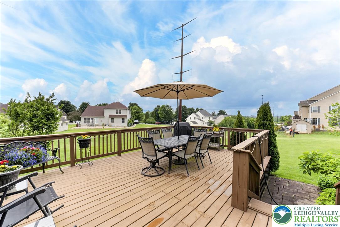 5440 Spring Ridge Drive West Macungie, PA 18062 - Photo 35 of 40 Step out onto a spacious wood deck, perfect for outdoor dining and entertaining.