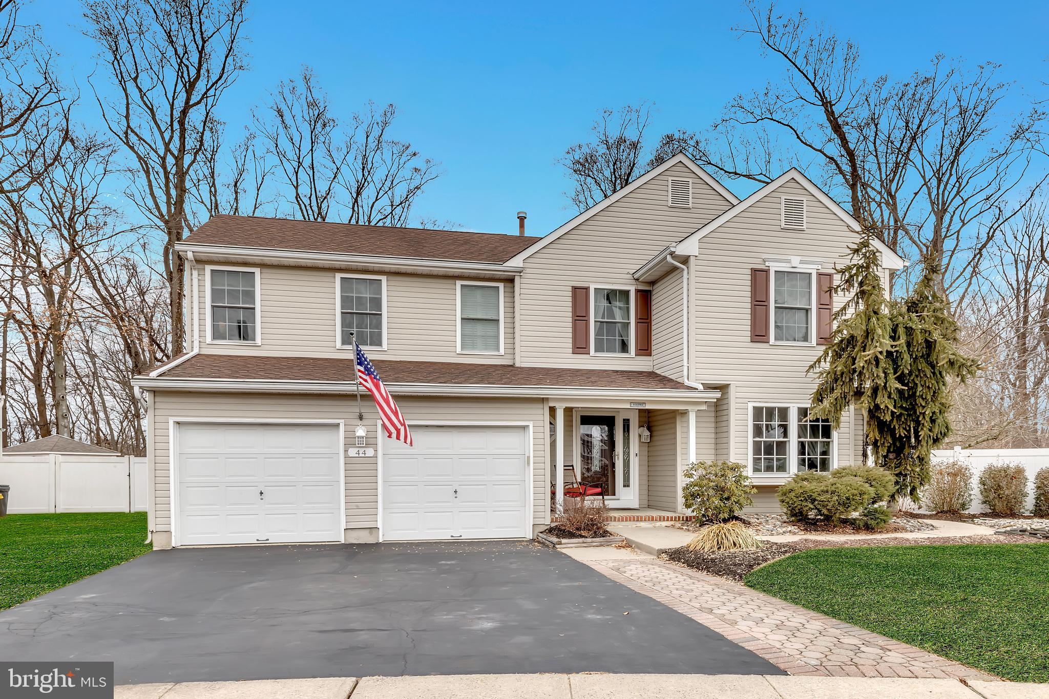 44 Kristopher Drive Hamilton, NJ 08620 - Photo 2 of 19 a front view of a house with a yard and garage