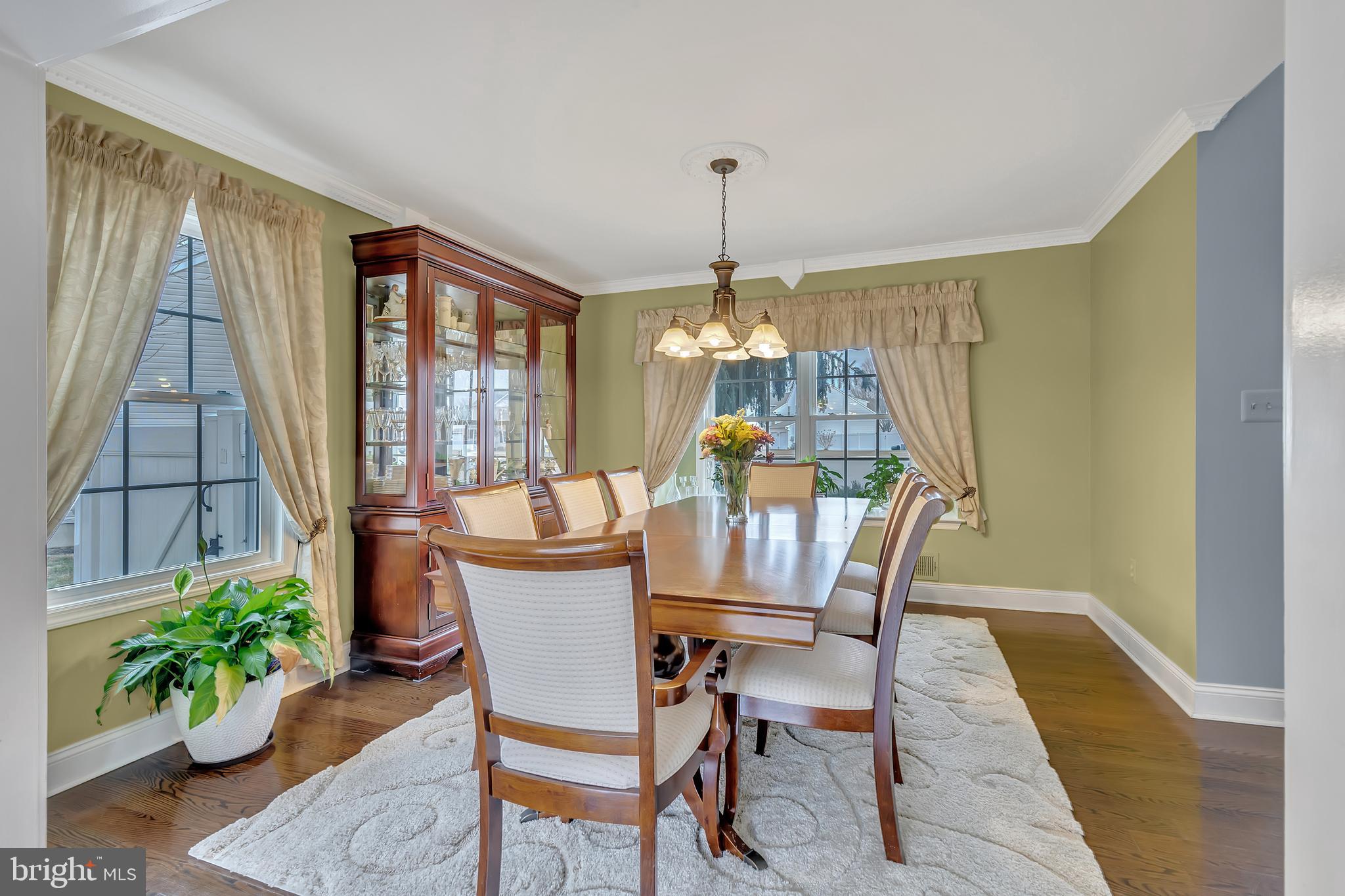 44 Kristopher Drive Hamilton, NJ 08620 - Photo 4 of 19 a dining room with furniture a chandelier and wooden floor
