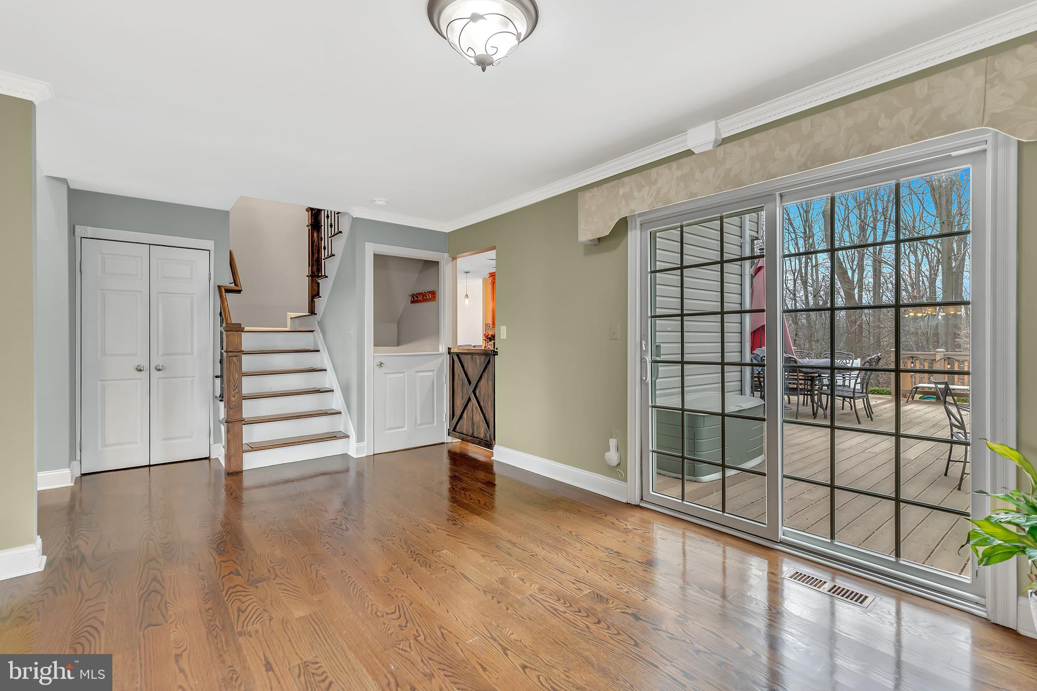 44 Kristopher Drive Hamilton, NJ 08620 - Photo 7 of 19 a view of an empty room with wooden floor and stairs