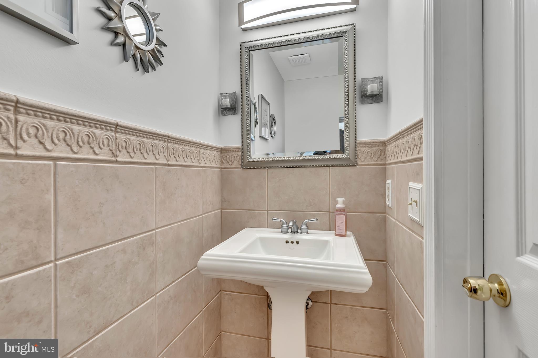 44 Kristopher Drive Hamilton, NJ 08620 - Photo 8 of 19 a bathroom with a sink and mirror