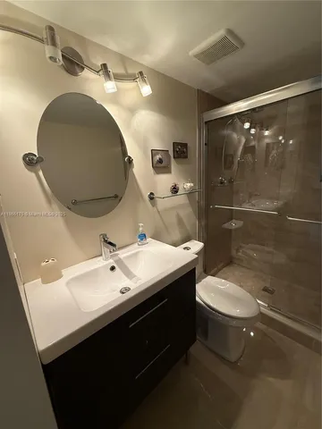 a bathroom with a sink and mirror