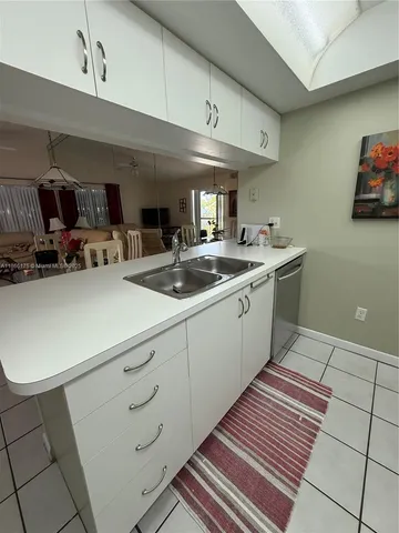 a kitchen with sink cabinets and bike