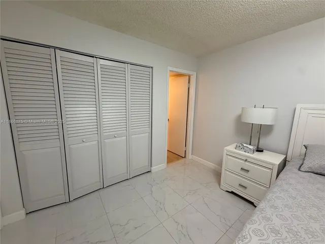 a room with a bed and a chair