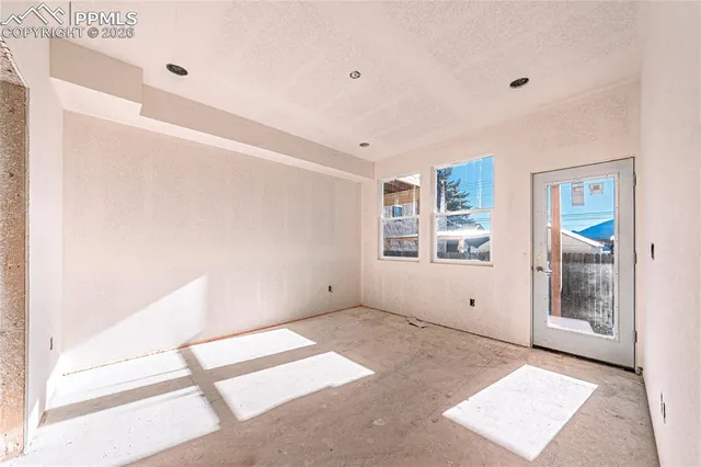 a view of a balcony with chairs