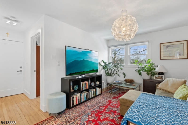 5 Washington Street Montclair, NJ 07042 - Photo 13 of 18 a living room with furniture and a flat screen tv