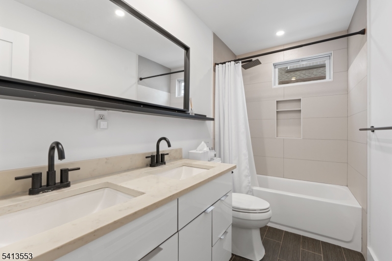 5 Washington Street Montclair, NJ 07042 - Photo 4 of 18 a bathroom with a sink a toilet and shower