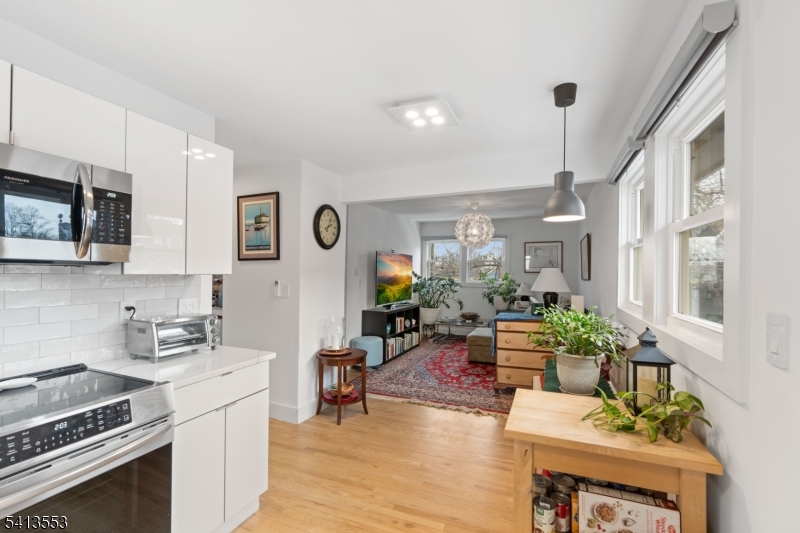 5 Washington Street Montclair, NJ 07042 - Photo 10 of 18 a living room with furniture dining table and a fireplace
