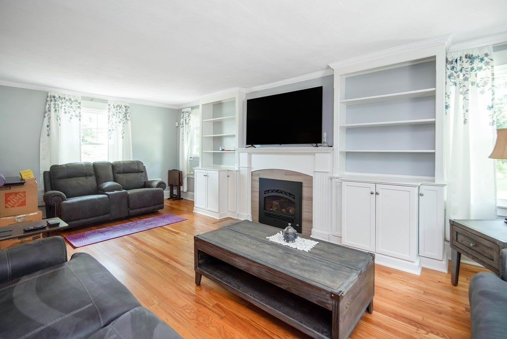 15 Three Rivers Road Wilbraham, MA 01095 - Photo 23 of 37 a living room with furniture flat screen tv and a fireplace
