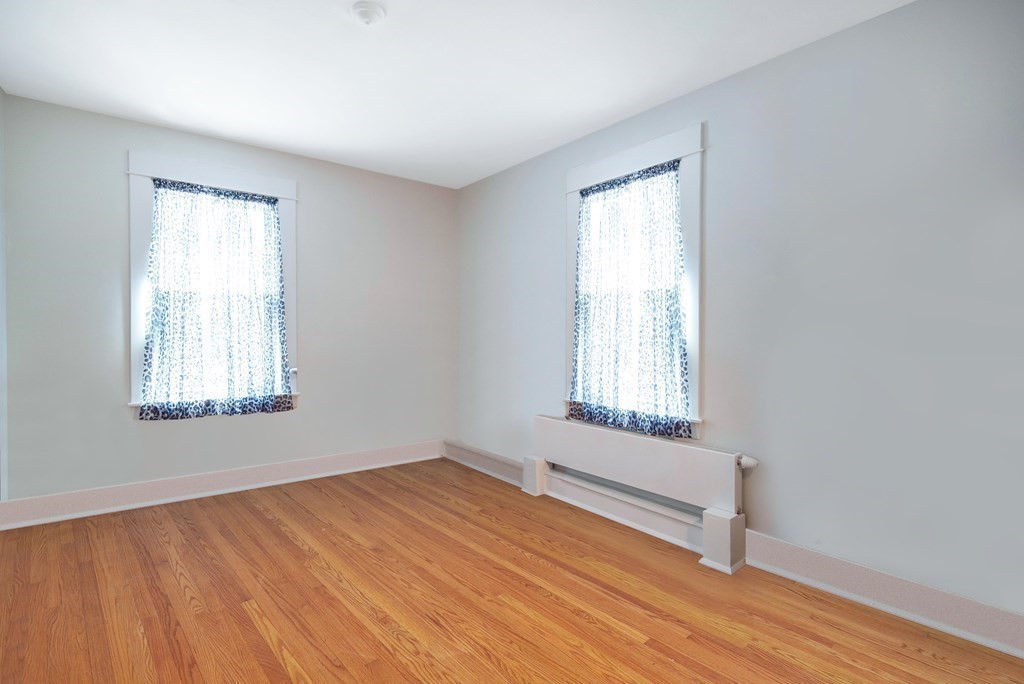 15 Three Rivers Road Wilbraham, MA 01095 - Photo 29 of 37 a view of an empty room with wooden floor and a window
