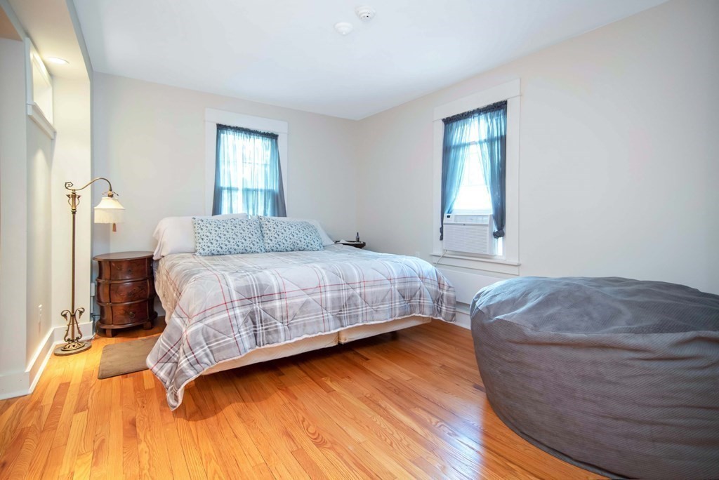15 Three Rivers Road Wilbraham, MA 01095 - Photo 35 of 37 a bedroom with a bed and wooden floor