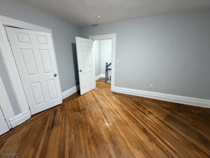 213 North 7th Street Newark, NJ 07107 - Photo 11 of 20 a view of empty room with wooden floor