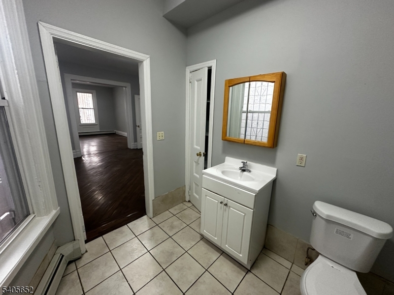 213 North 7th Street Newark, NJ 07107 - Photo 8 of 20 a bathroom with a sink toilet and shower