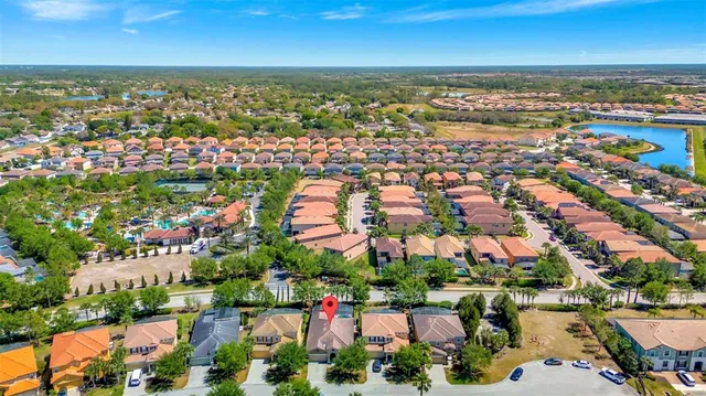 an aerial view of residential building and lake