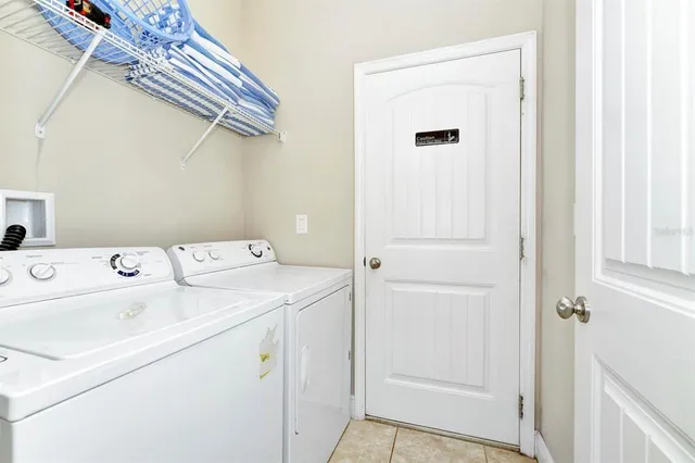 an aerial view of residential building and lake