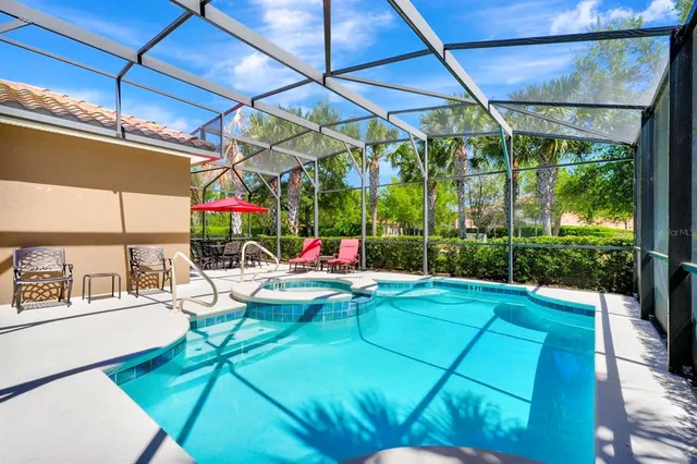 a view of swimming pool with a patio