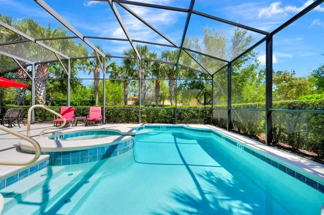 a view of swimming pool with a patio