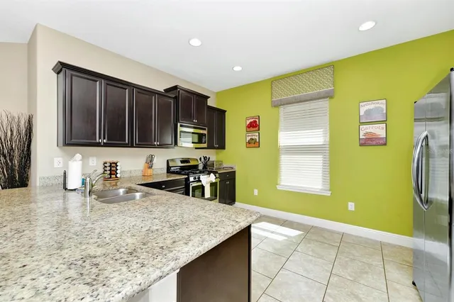 a kitchen with a sink and a microwave