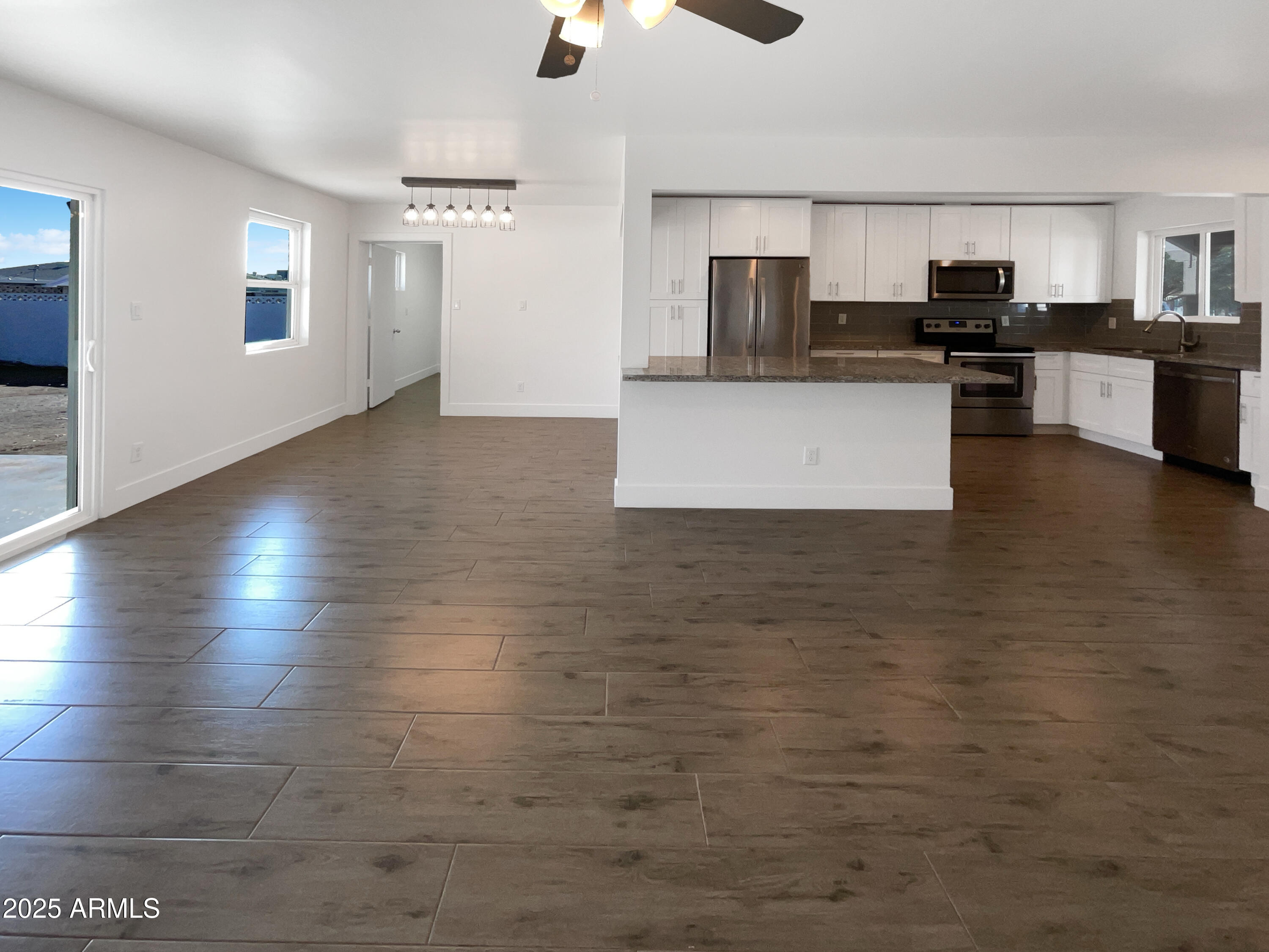 7231 North 23rd Avenue Phoenix, AZ 85021 - Photo 13 of 28 a view of a kitchen with microwave and cabinets