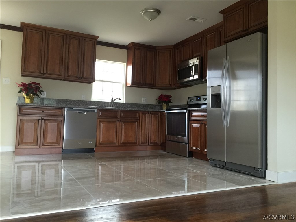 5315 Courthouse Road Chesterfield, VA 23832 - Photo 5 of 23 a kitchen with stainless steel appliances granite countertop a refrigerator and a sink