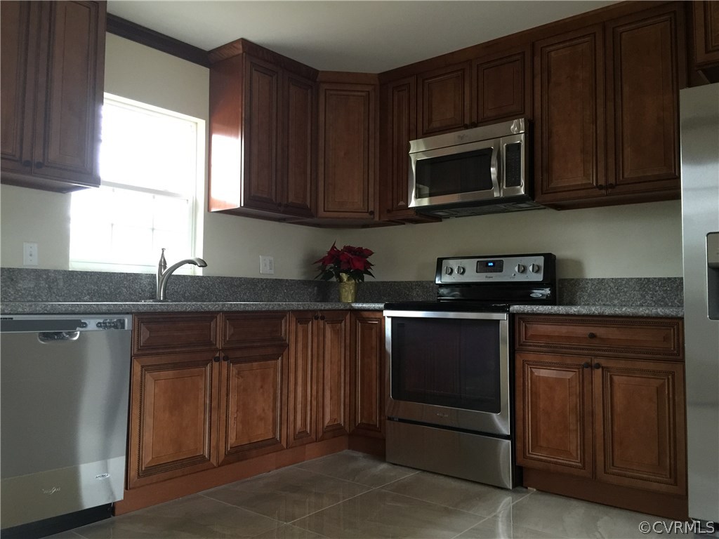 5315 Courthouse Road Chesterfield, VA 23832 - Photo 7 of 23 a kitchen with granite countertop wood cabinets stainless steel appliances and a window