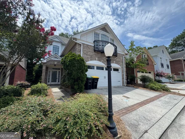 a front view of a house with yard