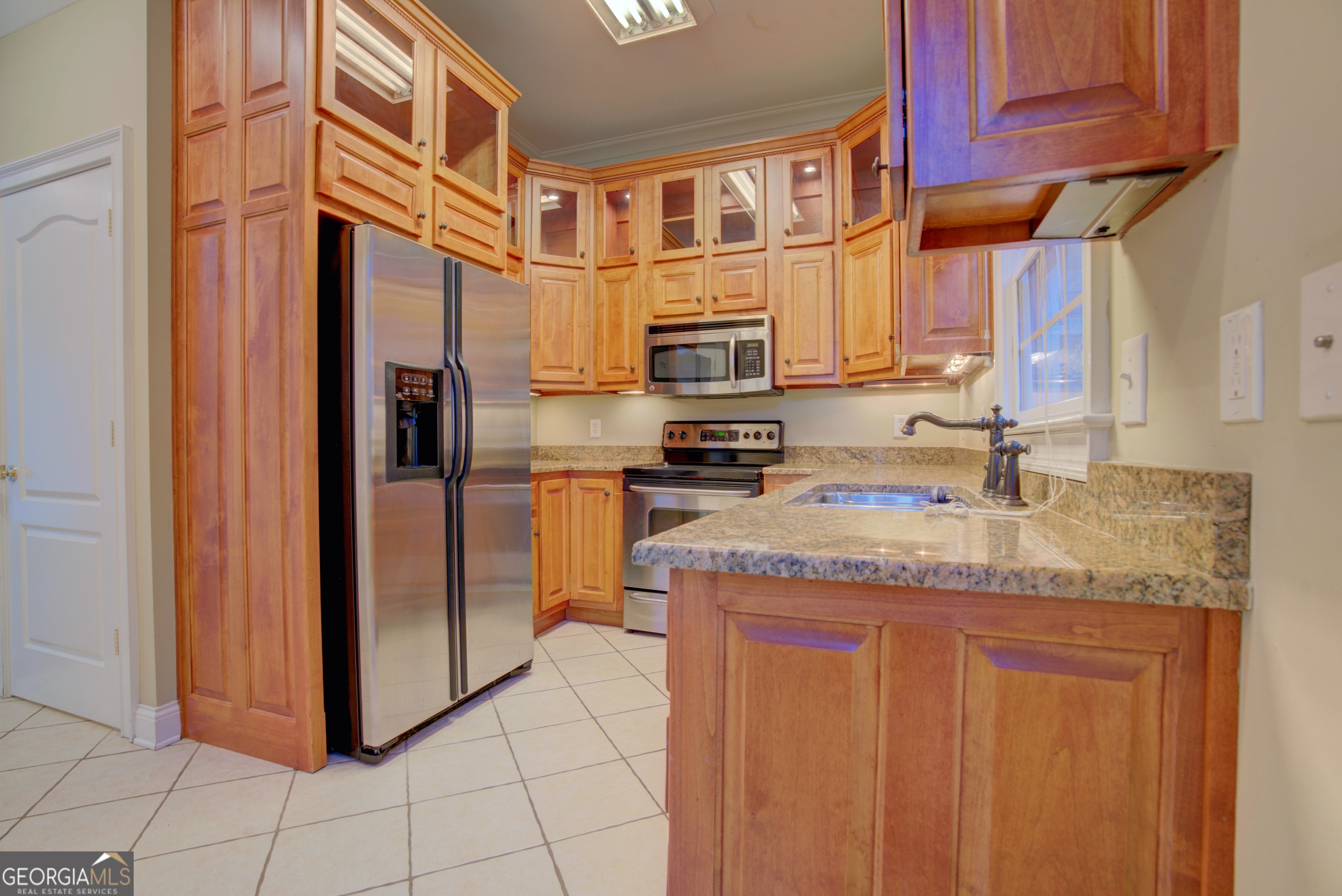 29 Pear Street Rome, GA 30161 - Photo 22 of 55 a kitchen with stainless steel appliances granite countertop a refrigerator and a sink