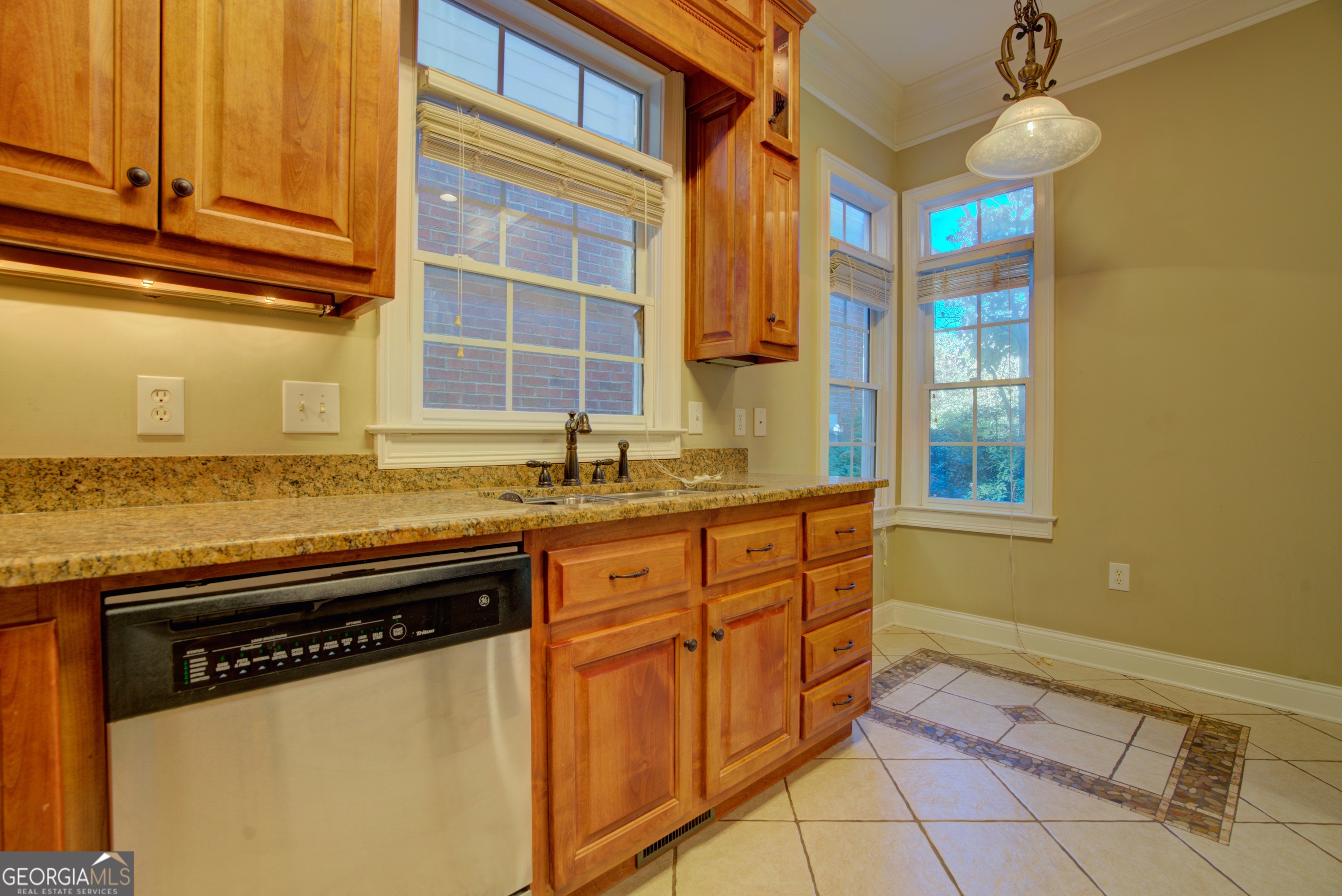 29 Pear Street Rome, GA 30161 - Photo 24 of 55 a kitchen with granite countertop cabinets and window