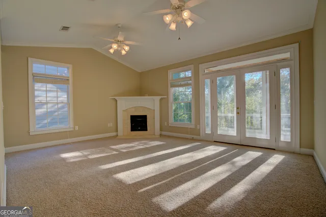 a view of a glass door and a yard
