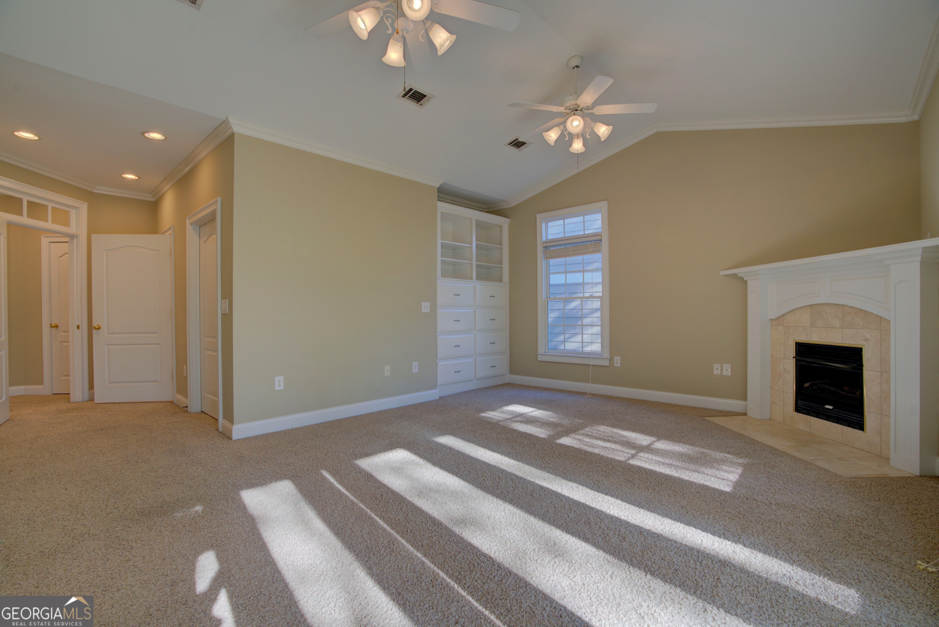 29 Pear Street Rome, GA 30161 - Photo 32 of 55 a view of an empty room with a fireplace and chandelier fan