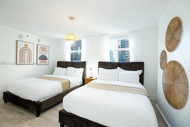 a bedroom with bed and a window