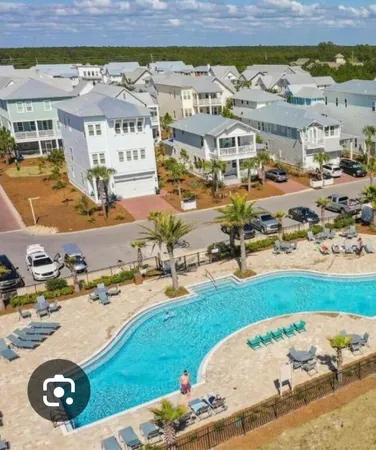 an aerial view of a house with a ocean view