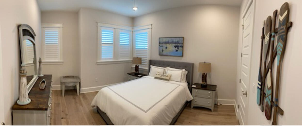 11 East Crabbing Hole Ln Inlet Beach Inlet Beach, FL 32461 - Photo 18 of 34 a bed room with a bed window and a chair